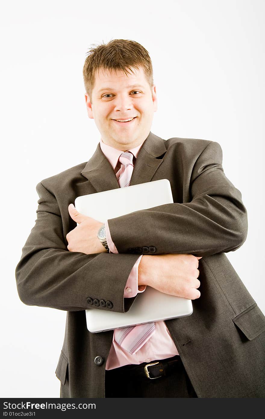 Young business man with laptop computer on white background