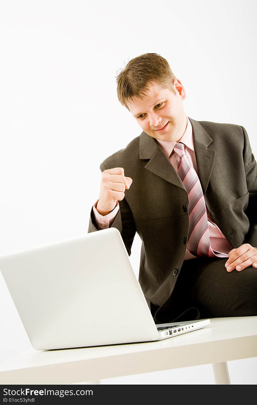 Young business man with laptop computer on white background