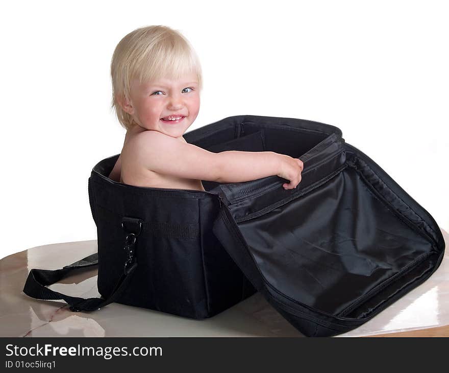 Cute child into big bag. Cute child into big bag