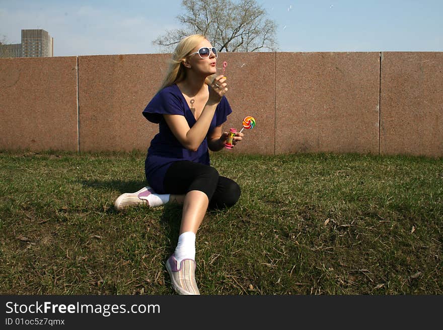 Girl blowing soap bubbles