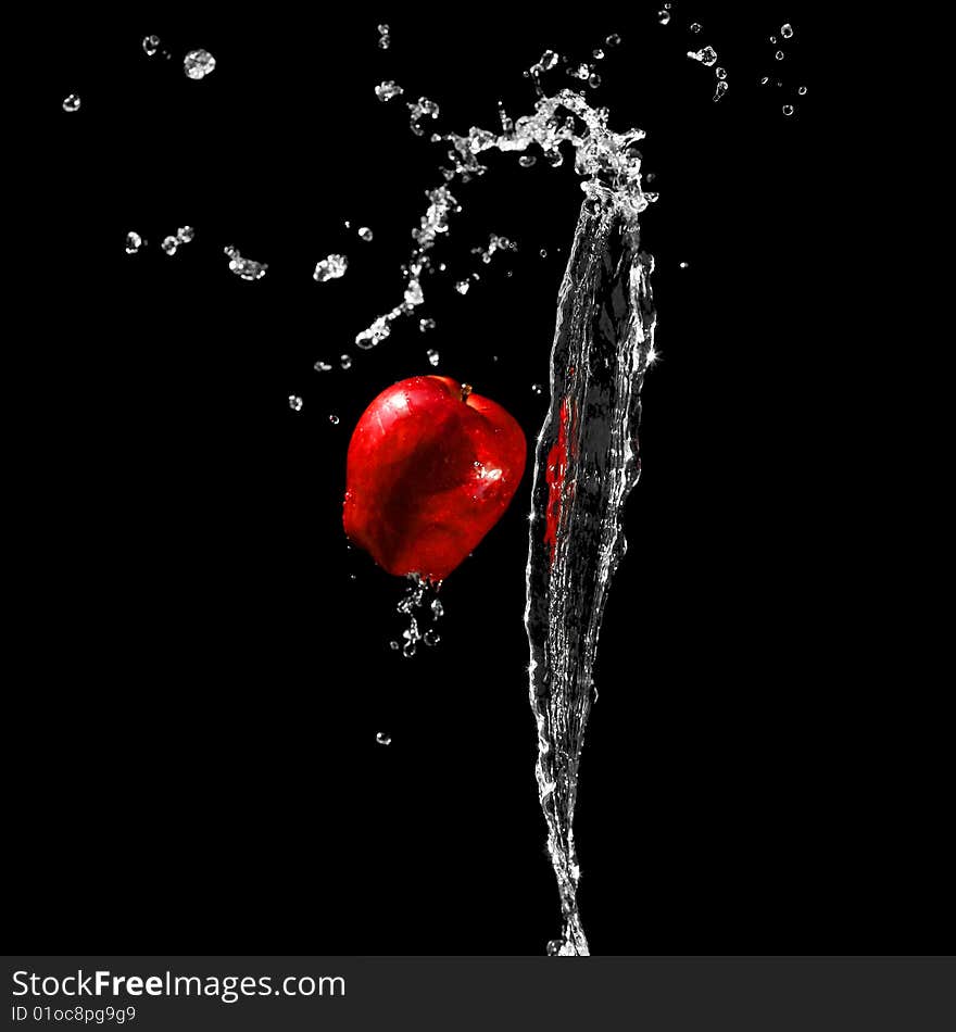 Red ripe apple in water stream. Red ripe apple in water stream