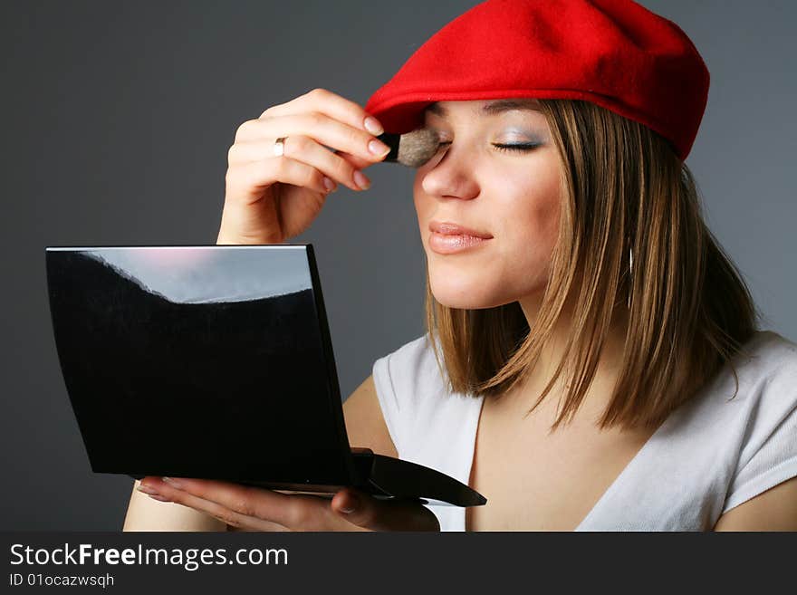 Beautiful woman in red cap with Make up