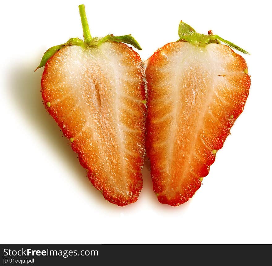 Two half one berry of a ripe strawberry close up. Two half one berry of a ripe strawberry close up