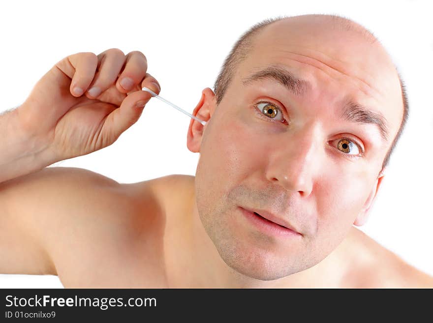 Funny looking man cleaning his ear with a q-tip (isolated on white). Funny looking man cleaning his ear with a q-tip (isolated on white)