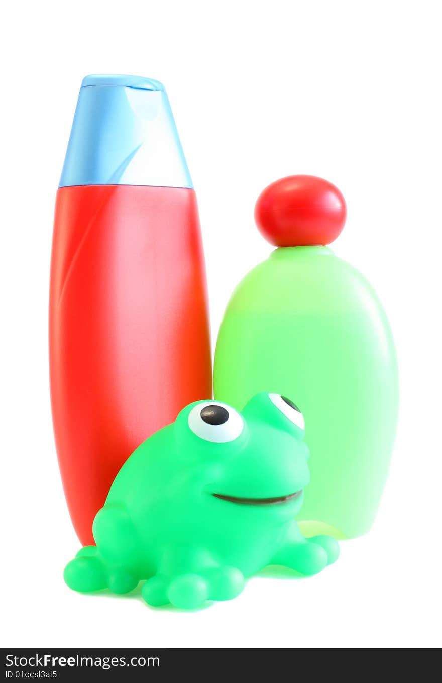 Shower gel, shampoo and toy on a white background. Children's. Shower gel, shampoo and toy on a white background. Children's.