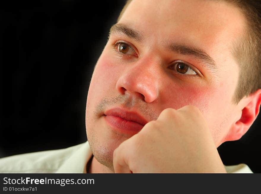 Portrait of serious young man in shirt. Portrait of serious young man in shirt