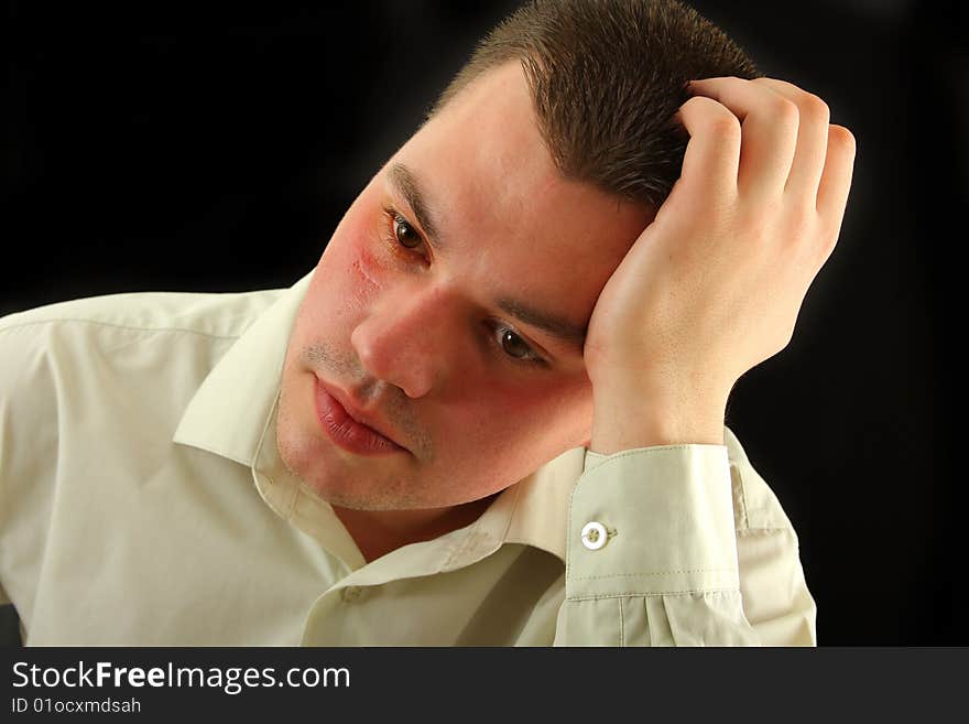 Portrait of serious young man in shirt. Portrait of serious young man in shirt