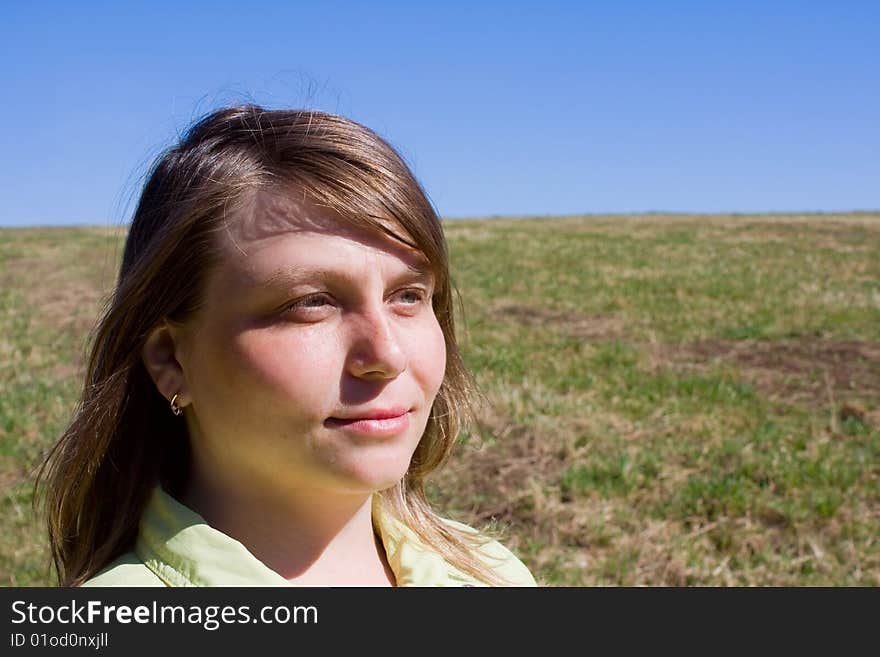 Smiling girl in a field