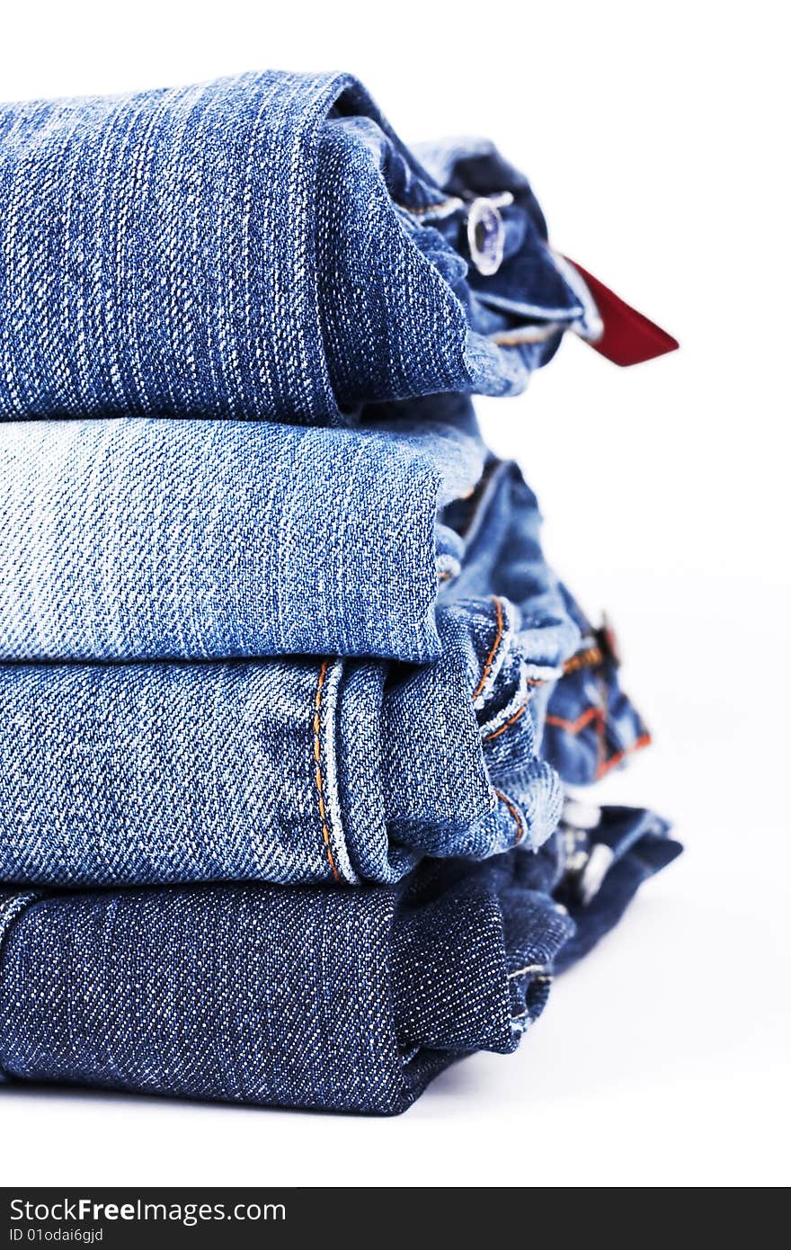 Stack of Blue Jeans isolated over white