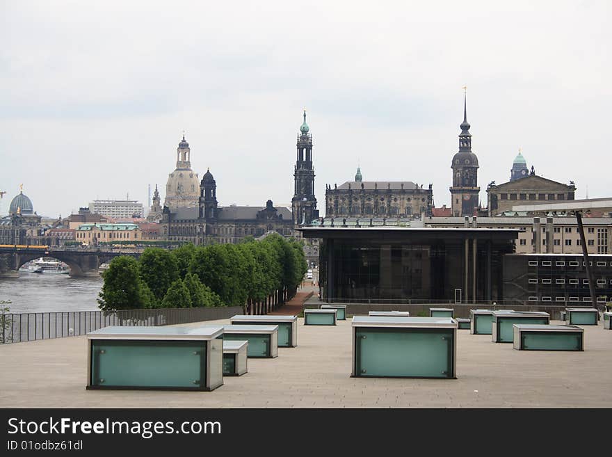 Modern architecture with baroque building in background