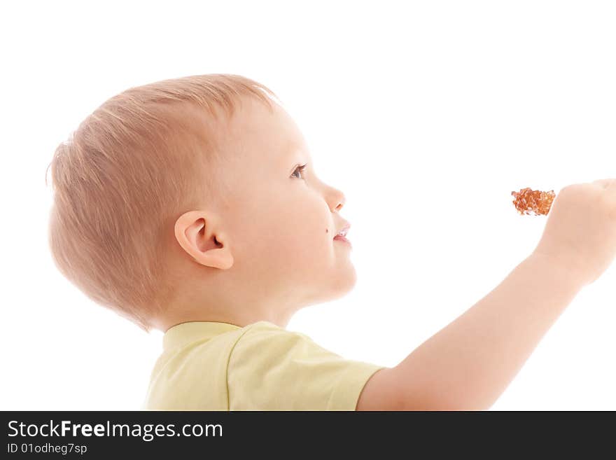 Portrait of joyful boy reach sugar candy. Over white background