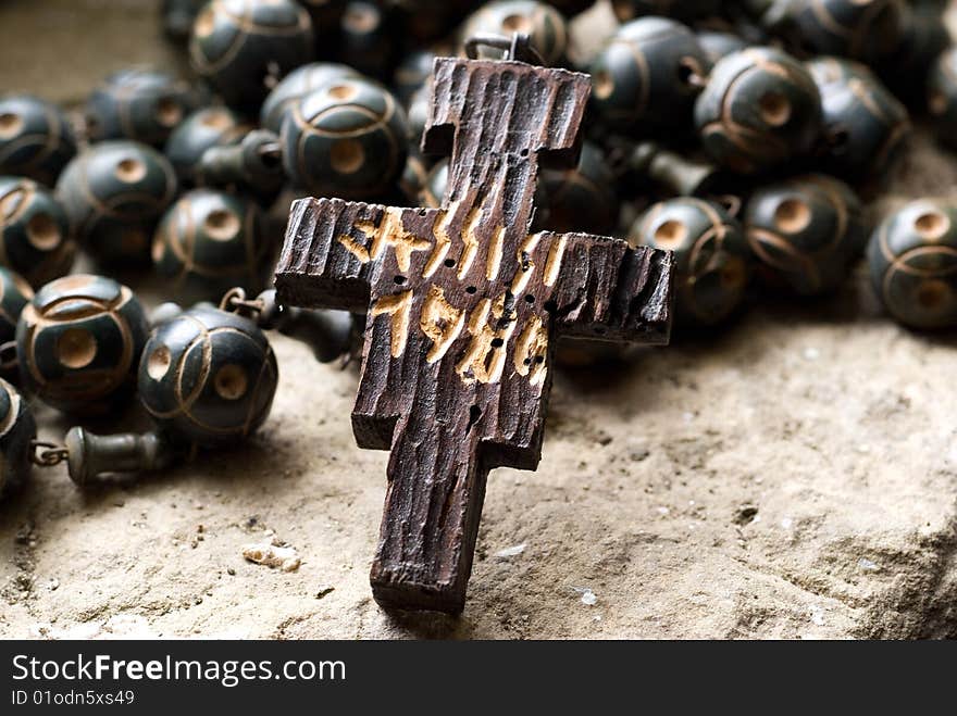 Old wooden beads with a cross. Old wooden beads with a cross