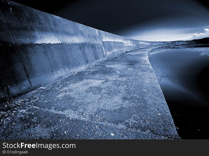 On a quay of the port of concrete, abandoned and degraded