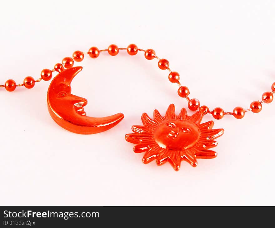 Red moon and sun ornaments on white