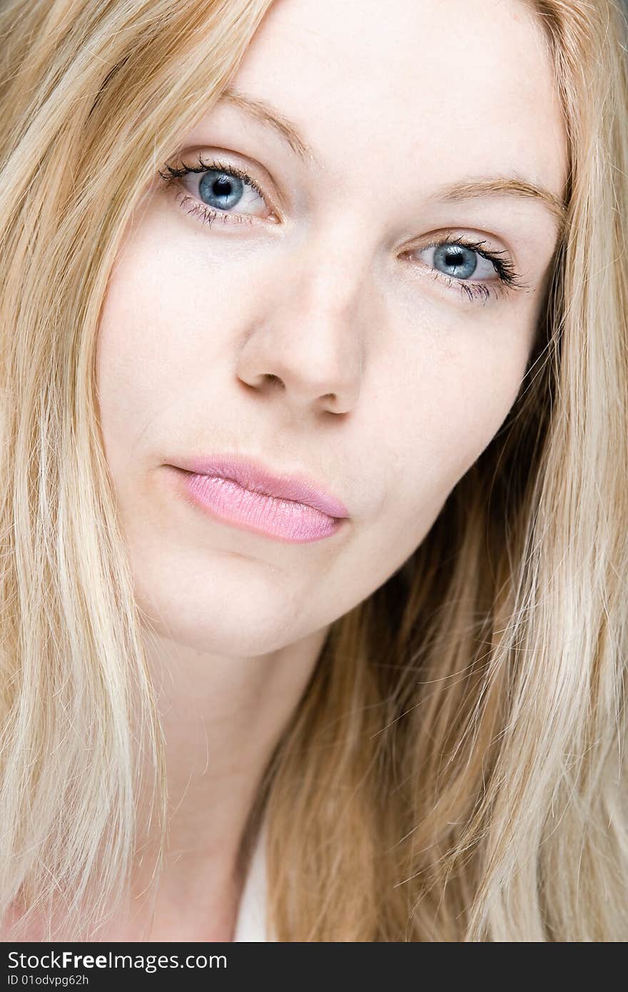 A closeup of a natural young blonde woman. A closeup of a natural young blonde woman