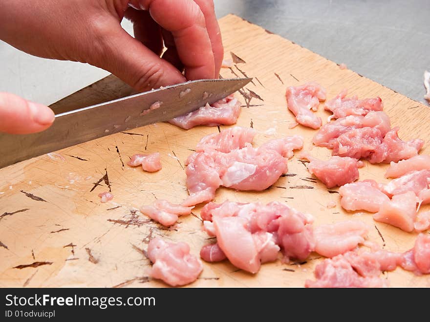 Raw sliced chicken on plate. Raw sliced chicken on plate