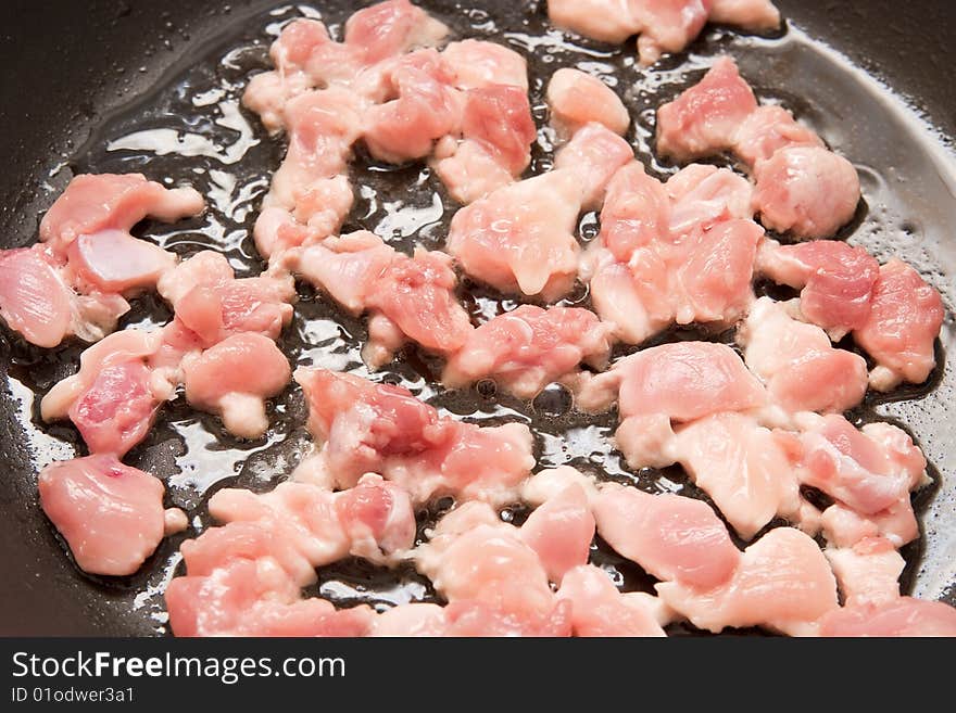 Raw sliced chicken on plate. Raw sliced chicken on plate