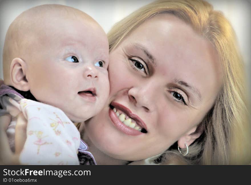 Family picture of mother holding baby girl. Family picture of mother holding baby girl.