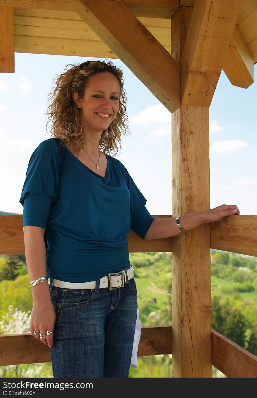 Curly girl on lookout tower