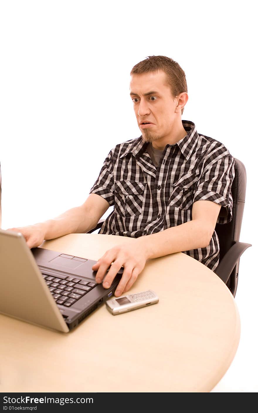 Man with phone working in office