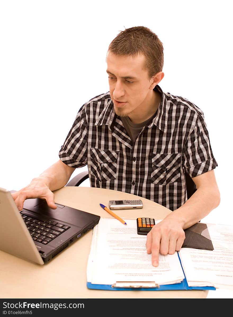 Man with phone working in office