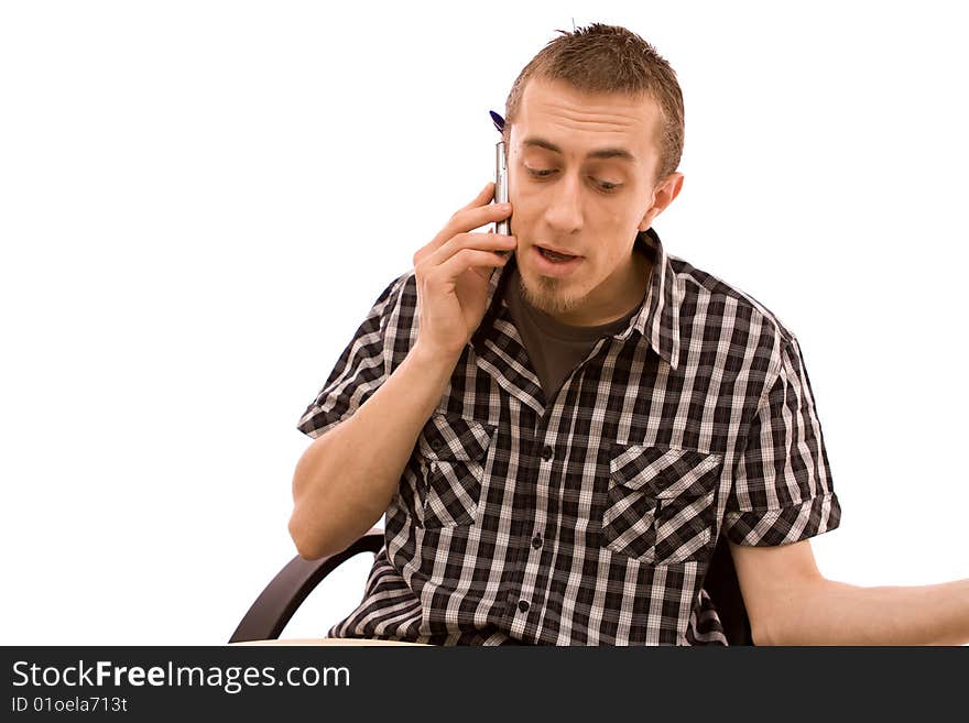 Man with phone working in office