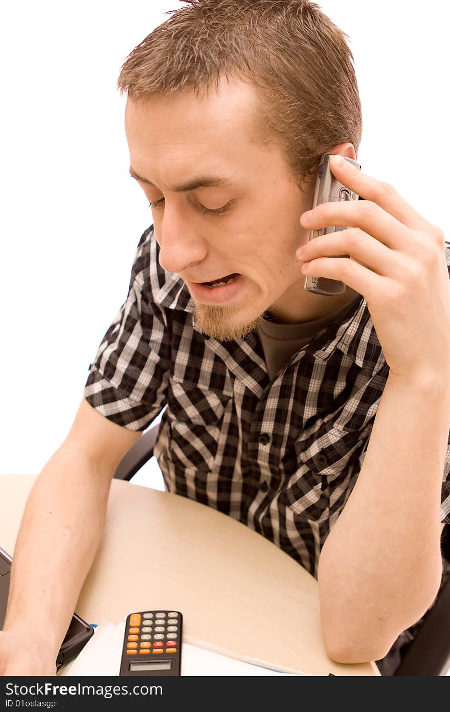 Man with phone working in office