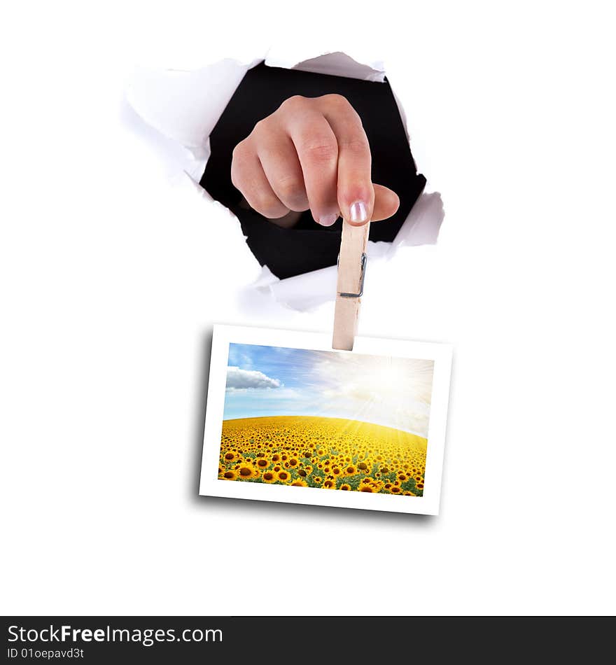 Woman hands holding clip thru wall hole