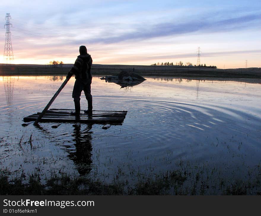 Person Sailing Raft On Lake