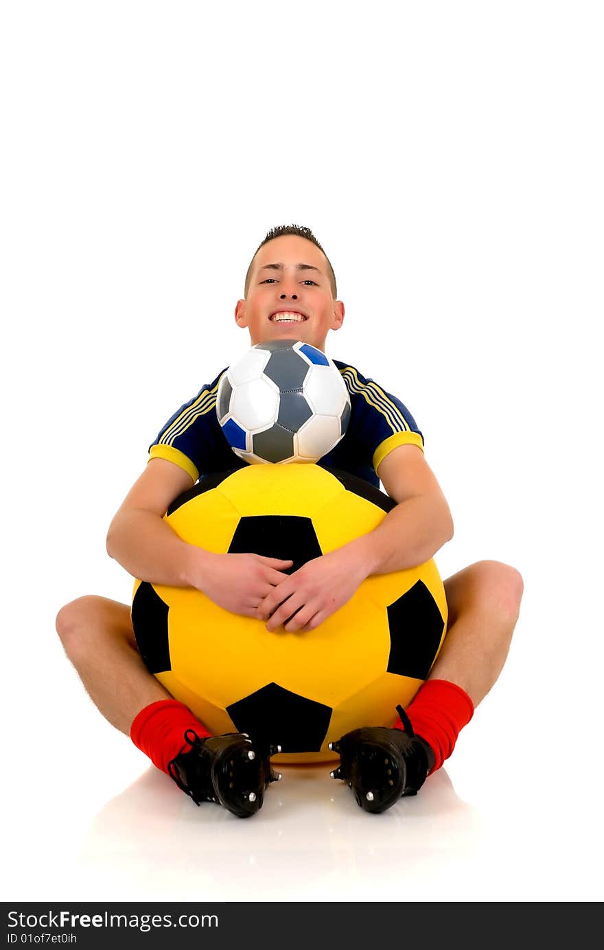 Young attractive happy soccer player with football on white background, studio shot. Young attractive happy soccer player with football on white background, studio shot