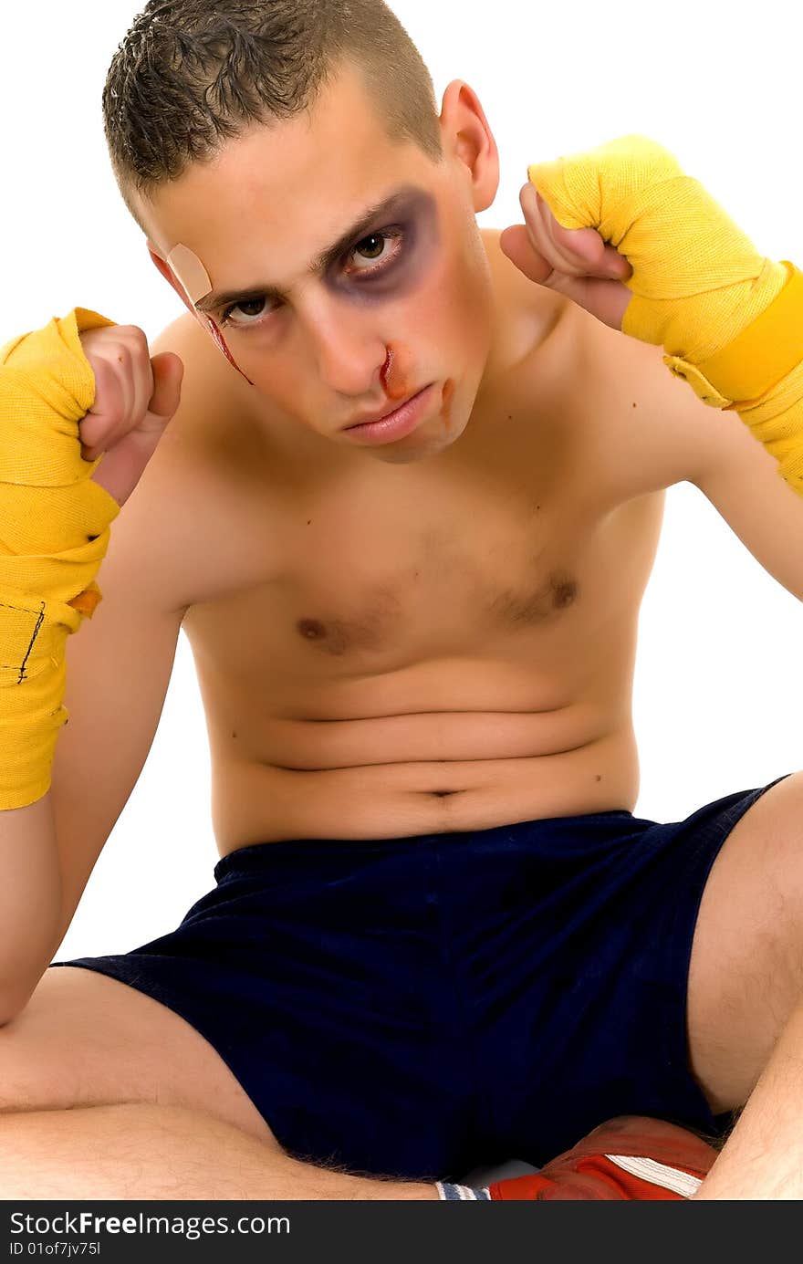 Youngster practicing the art of boxing, studio shot on white background