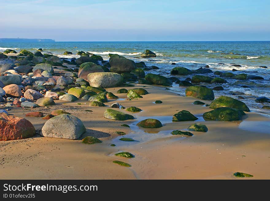 Bright sunny day, the sea, the sun, sand, a beach.