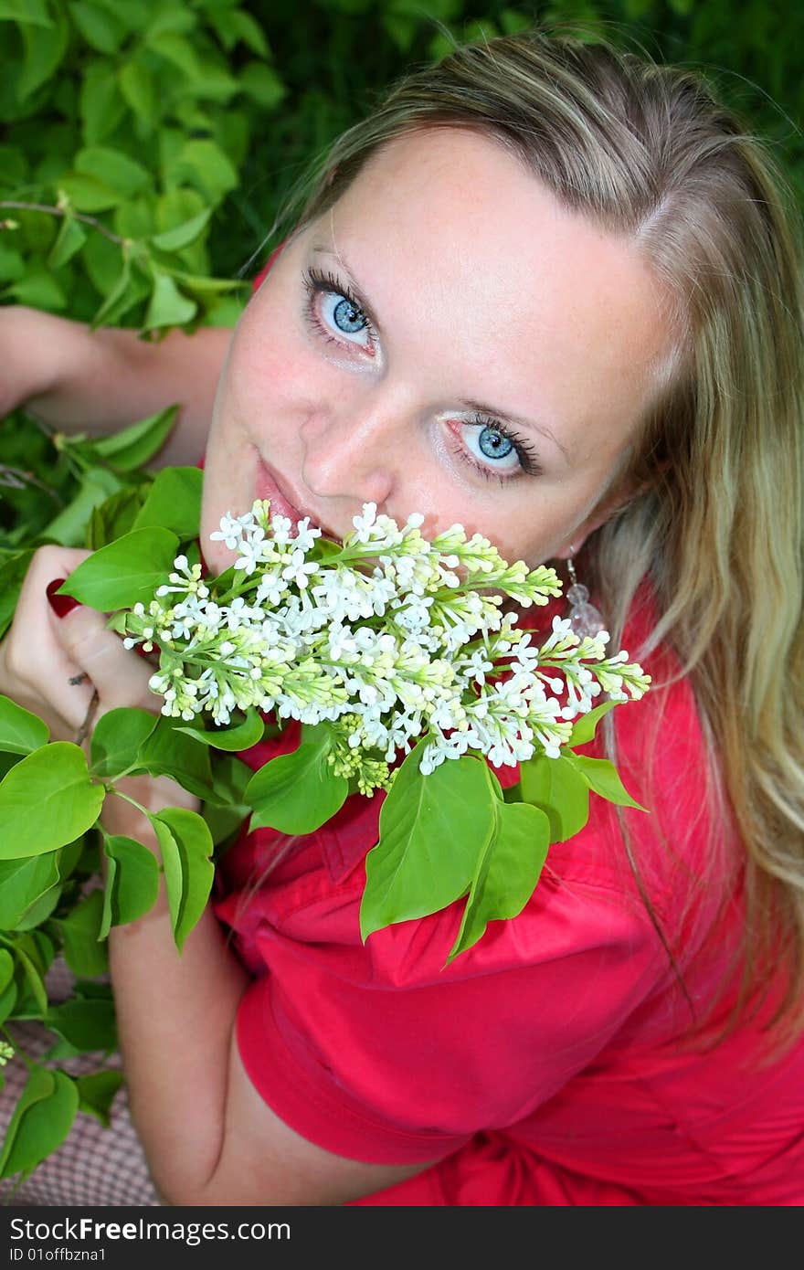 Young girl and lilac