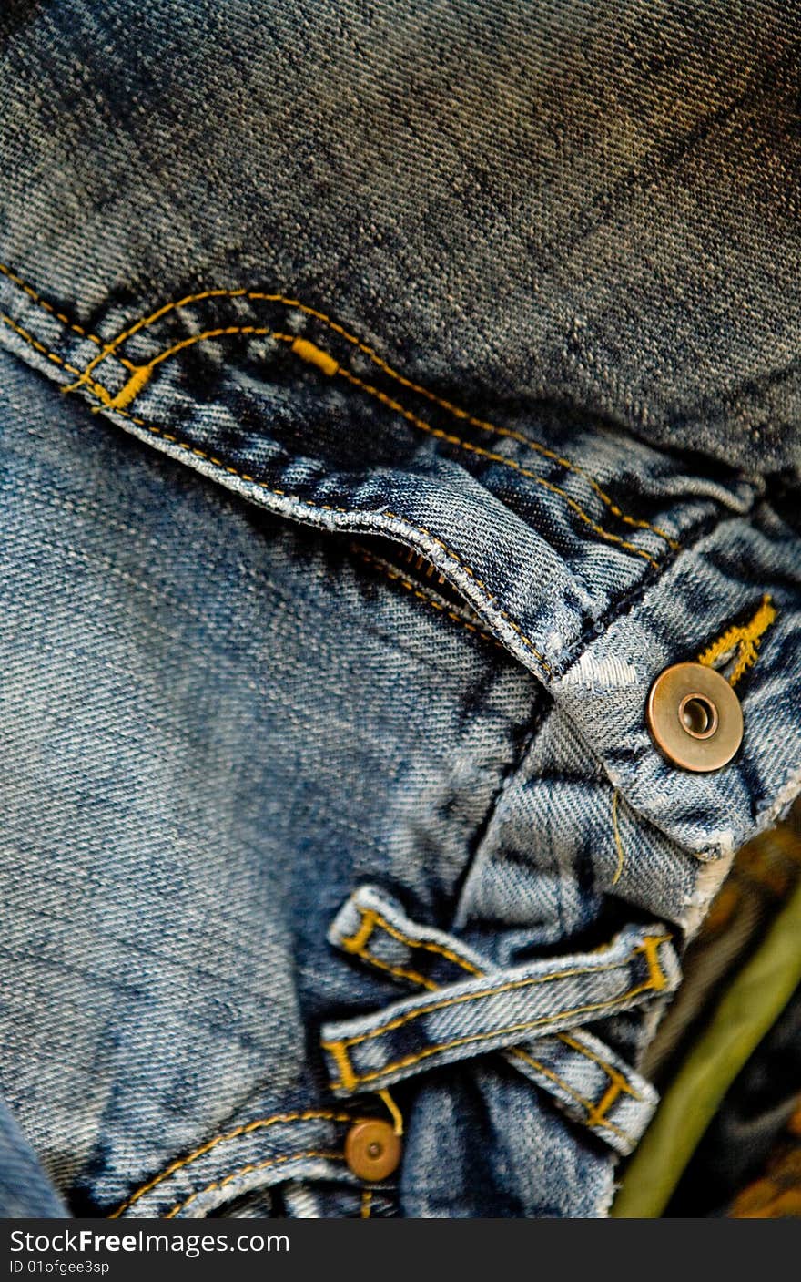 Old blue jeans with pocket and button