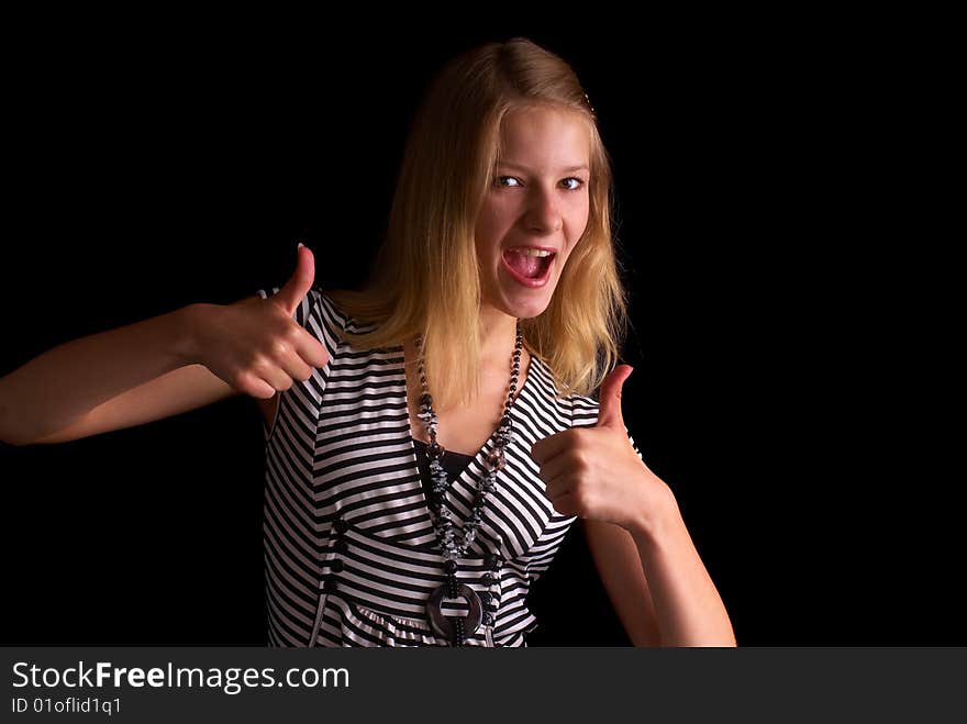 Beautiful portrait of a young girl with expressive eyes on the black background. Beautiful portrait of a young girl with expressive eyes on the black background