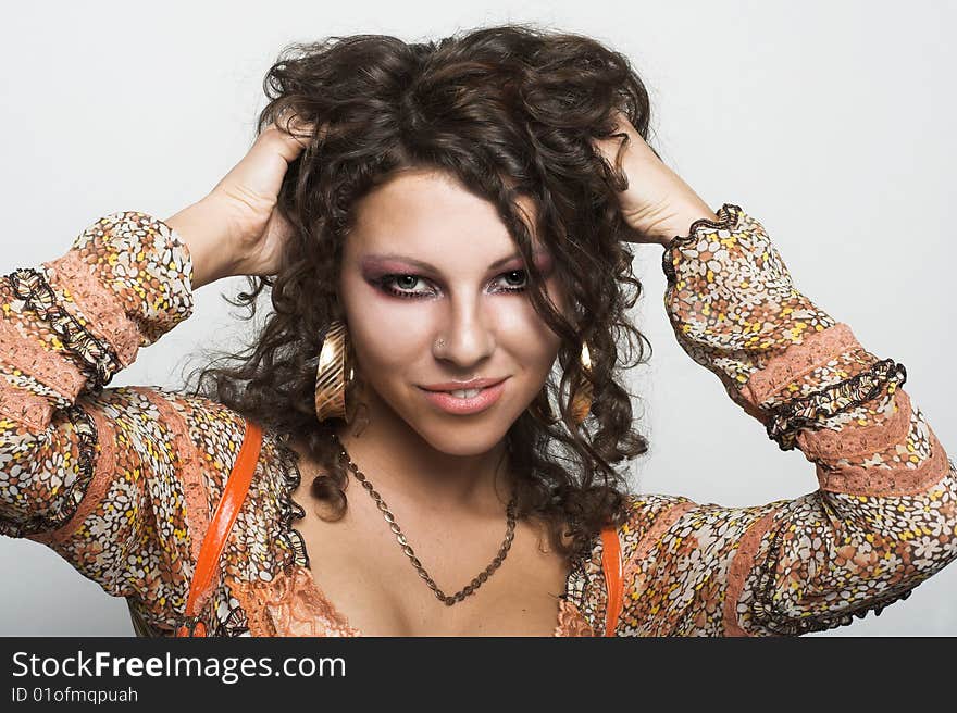 Portrait of young happy woman with long curly hair. Portrait of young happy woman with long curly hair.