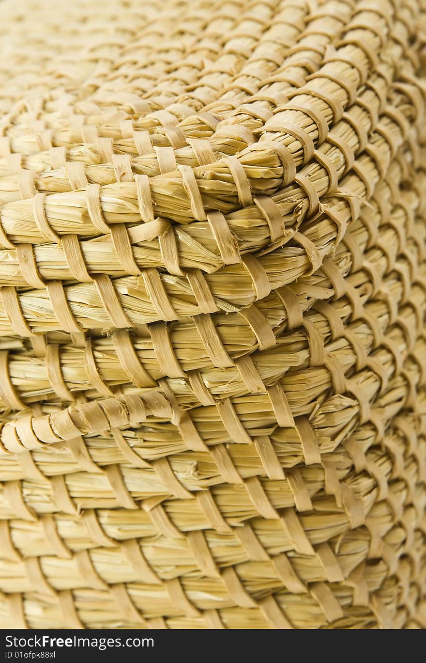 Close up photo of corner hay (straw) wove corner box (container) presenting texture in shallow dof. Close up photo of corner hay (straw) wove corner box (container) presenting texture in shallow dof