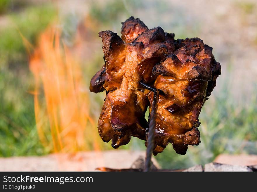 Sausages and chicken kebabs on a barbecue. Sausages and chicken kebabs on a barbecue