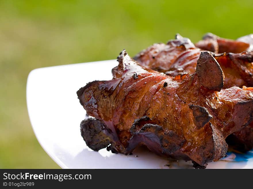 Sausages and chicken kebabs on a barbecue. Sausages and chicken kebabs on a barbecue