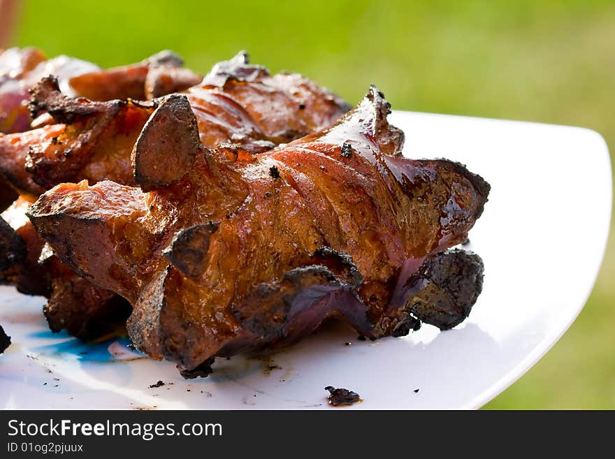 Sausages and chicken kebabs on a barbecue. Sausages and chicken kebabs on a barbecue