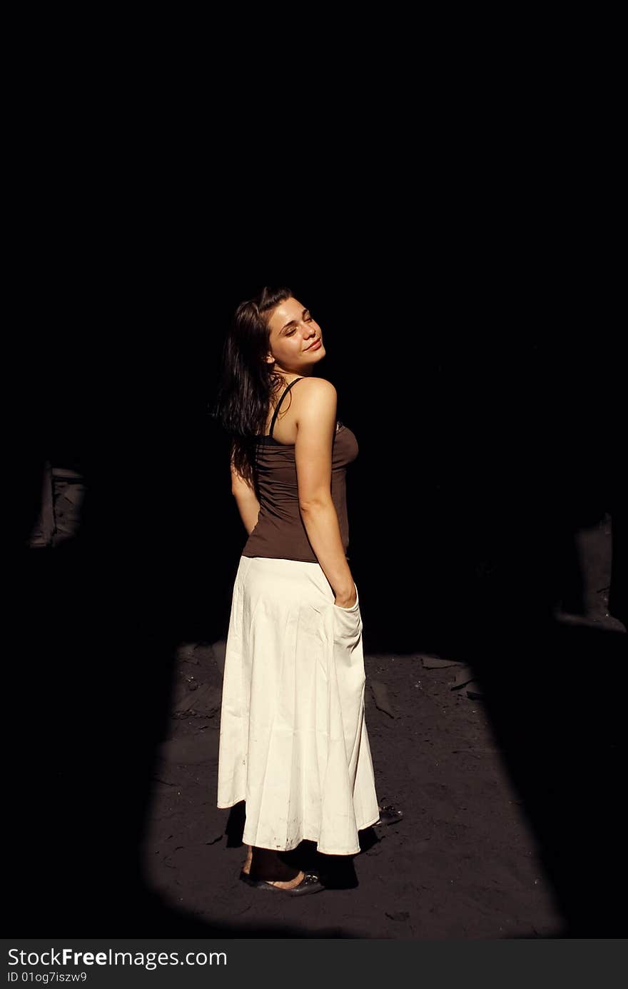 Young woman in a white dress smiling. Young woman in a white dress smiling