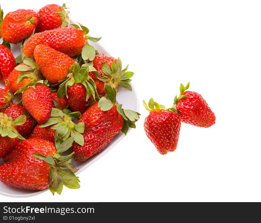 Fresh strawberries on a platter isolated on white background