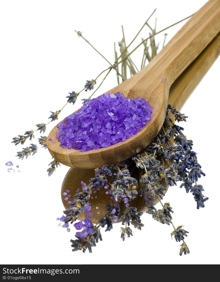 Bath salt in a wooden spoon with lavender