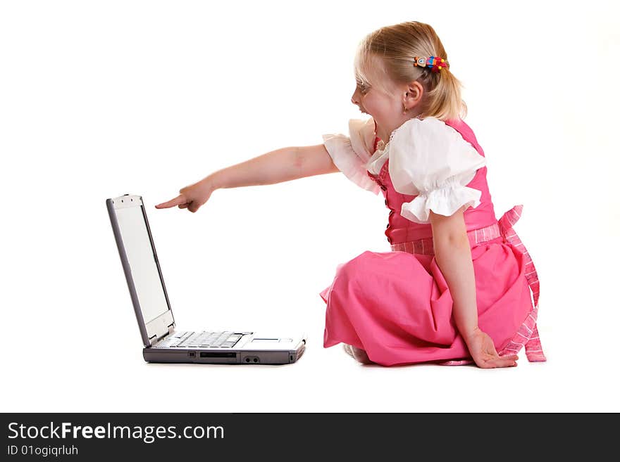 Young child sitting on computer found someting funny. Young child sitting on computer found someting funny