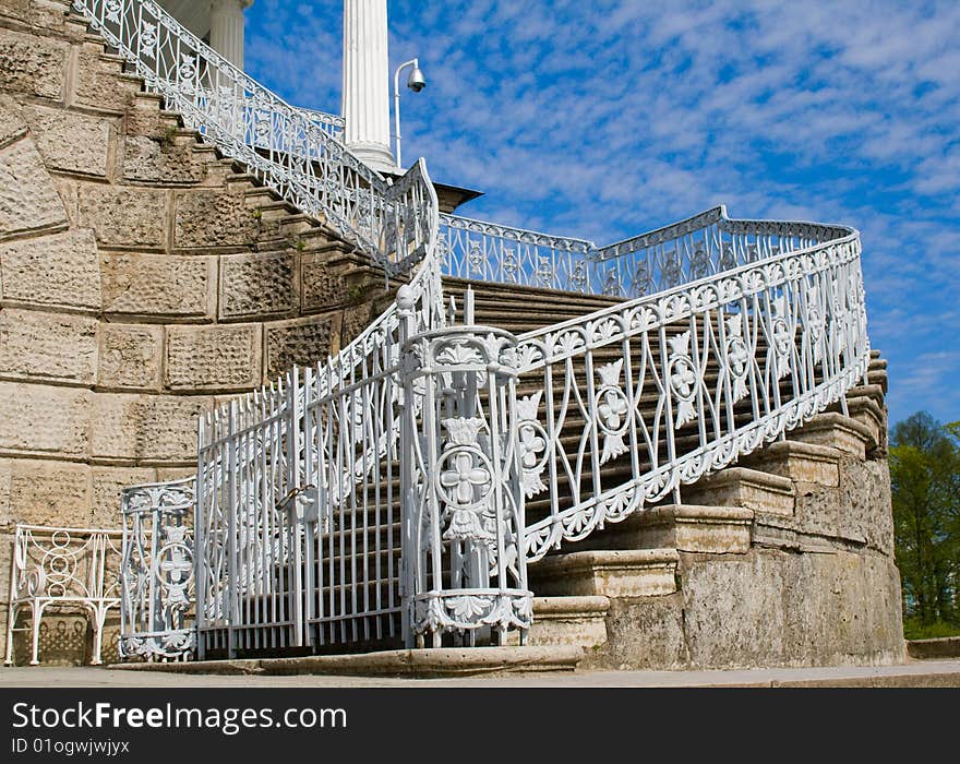 Beautiful classic stairs with metal handrail