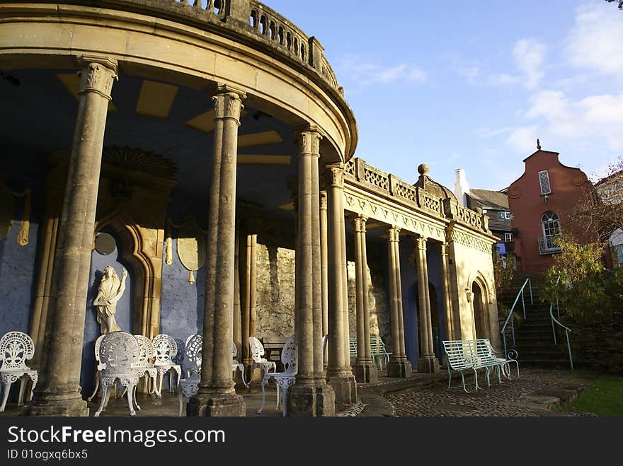 Bristol Collonade with chairs and benches, in Portmeirion, North Wales. Bristol Collonade with chairs and benches, in Portmeirion, North Wales.