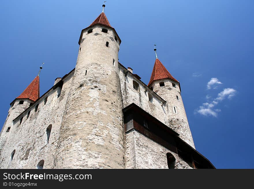 Thun Castle, Thun, Switzerland looking up from a low angle with blue sky.