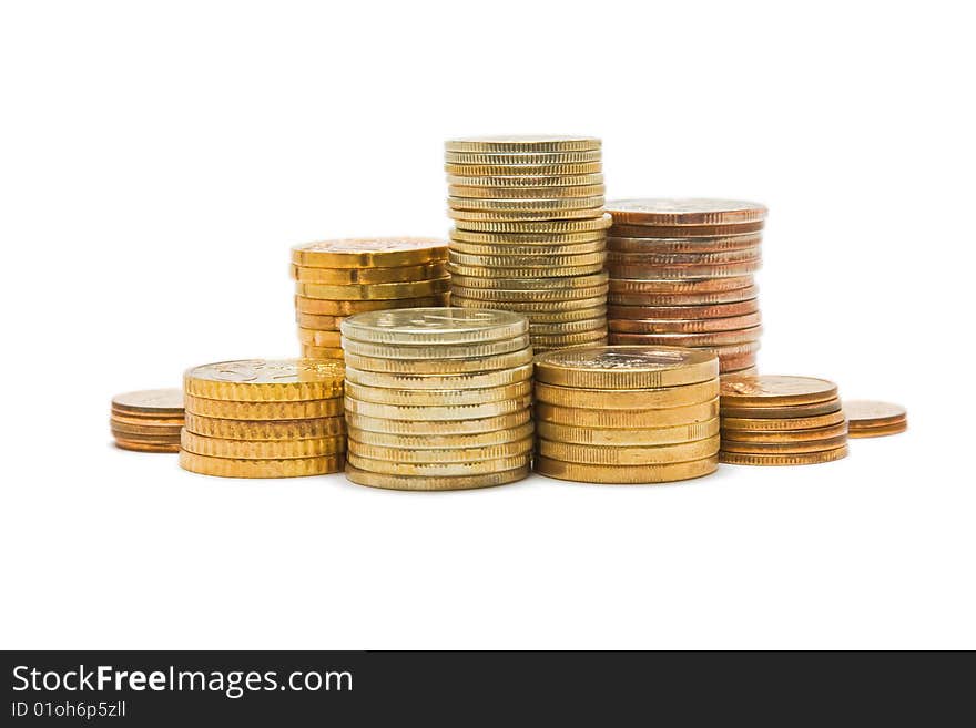 Several piles of coins isolated on white