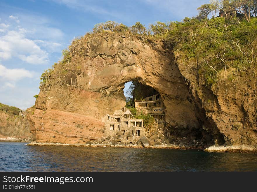 Abandon Art Colony at Adams Bay on thge island of Bequia, Grenadines. Unique tourist destination builted in the 60's, The arch is also refered to as the Moonhole. Abandon Art Colony at Adams Bay on thge island of Bequia, Grenadines. Unique tourist destination builted in the 60's, The arch is also refered to as the Moonhole