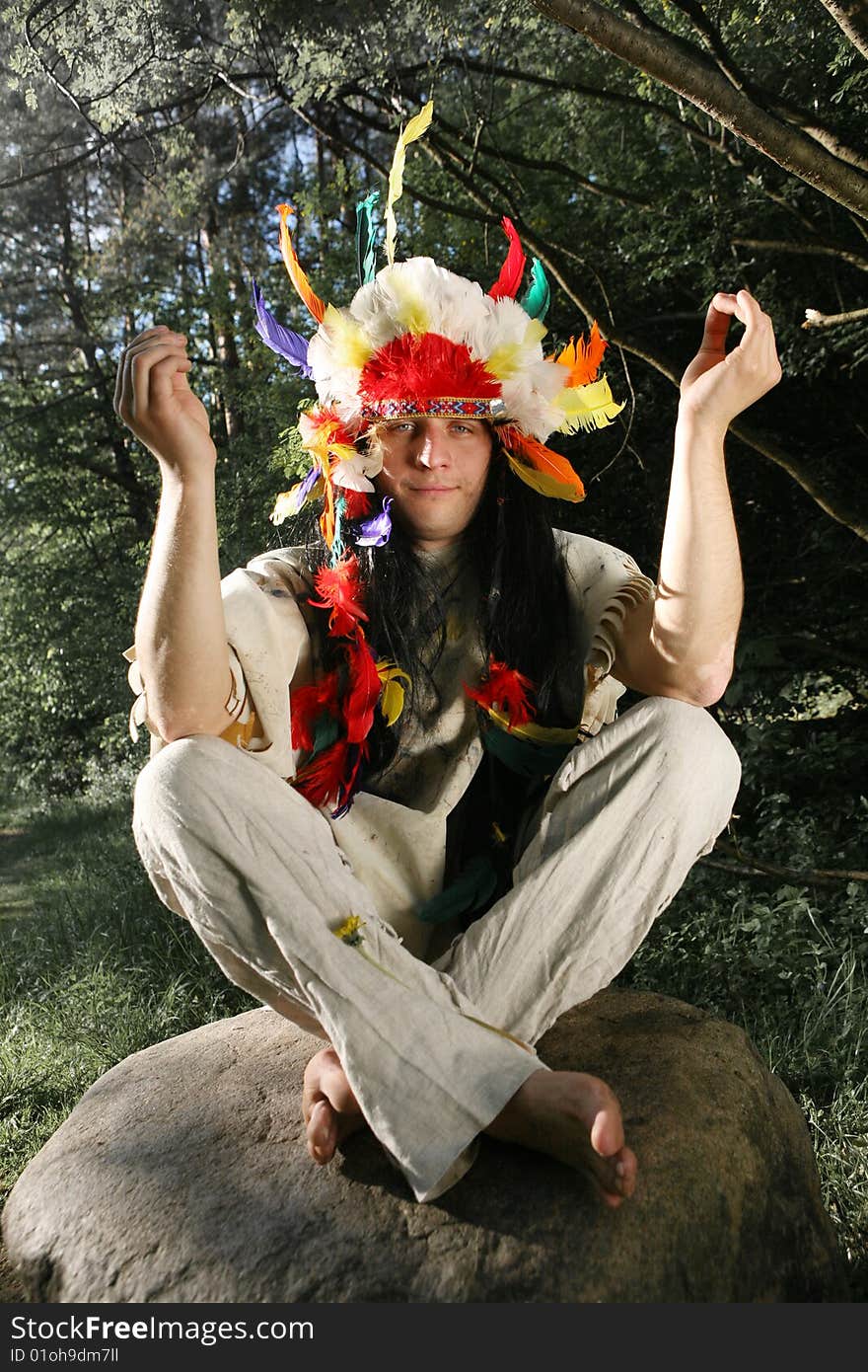 Indian meditating on the stone. Indian meditating on the stone.